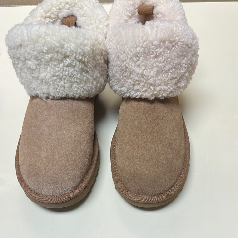 Brand new but one side faded. Ugg Ultra Mini Braid